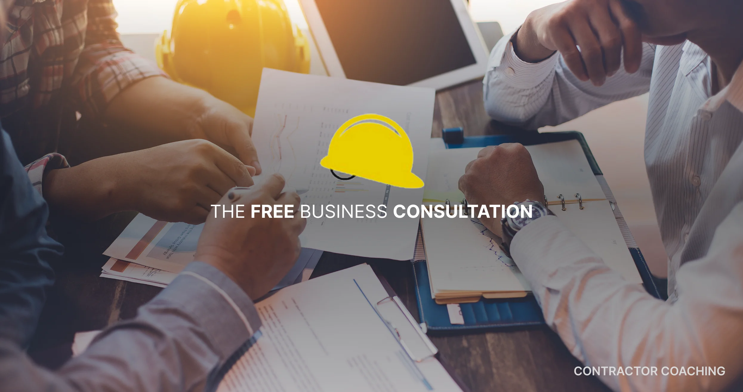 Free business consultation for contractors with team reviewing construction documents, charts, and planning materials